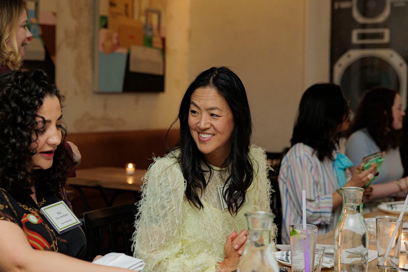 Judy Tsuei in conversation with founders at an SXSW dinner